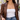 Stella Necklace in gold worn with a white tube top, brown leather jacket and jeans