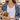 Woman wearing the Lexi Necklace with a denim jacket, holding a bouquet at a flower market