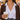 Addison heart necklace worn with a white shirt and brown cardigan at a fall festival