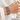 Mitas Bracelet stack worn on the wrist with a white linen shirt while holding a coffee cup