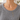 Close-up of the Shira Necklace's mariner link layers and lariat drop on a grey sweater