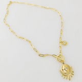 gold plated over brass. sun necklace.