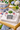 Americana topiary napkin weight with flags on napkins at bar cart