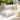 Clear acrylic napkin holder with cube feet on patio table