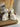 White ceramic spotted dog salt and pepper shakers on a wood board