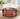 Dark acrylic octagon bowl with bright florals on side table