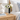 Faceted Acrylic Bud Vase, Black, on a rattan nightstand