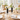 Two Faceted Acrylic Bud Vases, Black, on a dining table set for four