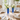 Two Faceted Acrylic Bud Vases, Blue, on a dining table set for four