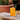Orchard Orange FIELDBAR Drinks Box with a spritz on a stone bench