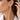 Woman in a white shirt wearing a gold link drop earring