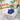 Blue hamsa napkin weight on napkins in an acrylic holder poolside