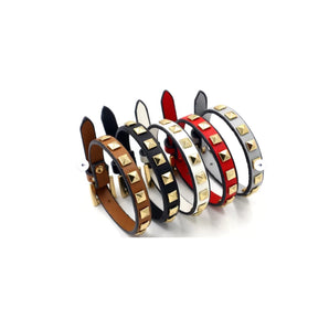 Vegan Leather bracelet with gold studs. These lovely studded bracelets are available in brown, red, and black.   Studs gold plated  Buckle closure 