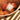 NEST Grapefruit candle in woven basket with citrus fruit