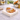 Pumpkin acrylic napkin weight on napkins with autumn flowers