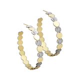 The Bianca 2" Hoops are crafted from 14k yellow gold-plated sterling silver, giving them an elegant, long-lasting shine. With a 2" diameter and 6mm thickness, they offer a balanced look with a modern aesthetic. Perfect for day and night looks.